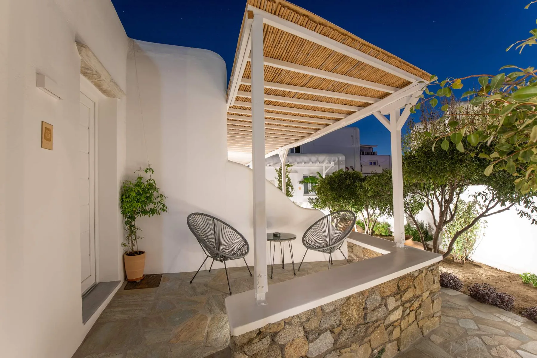 Reed pergola terrace lit at night